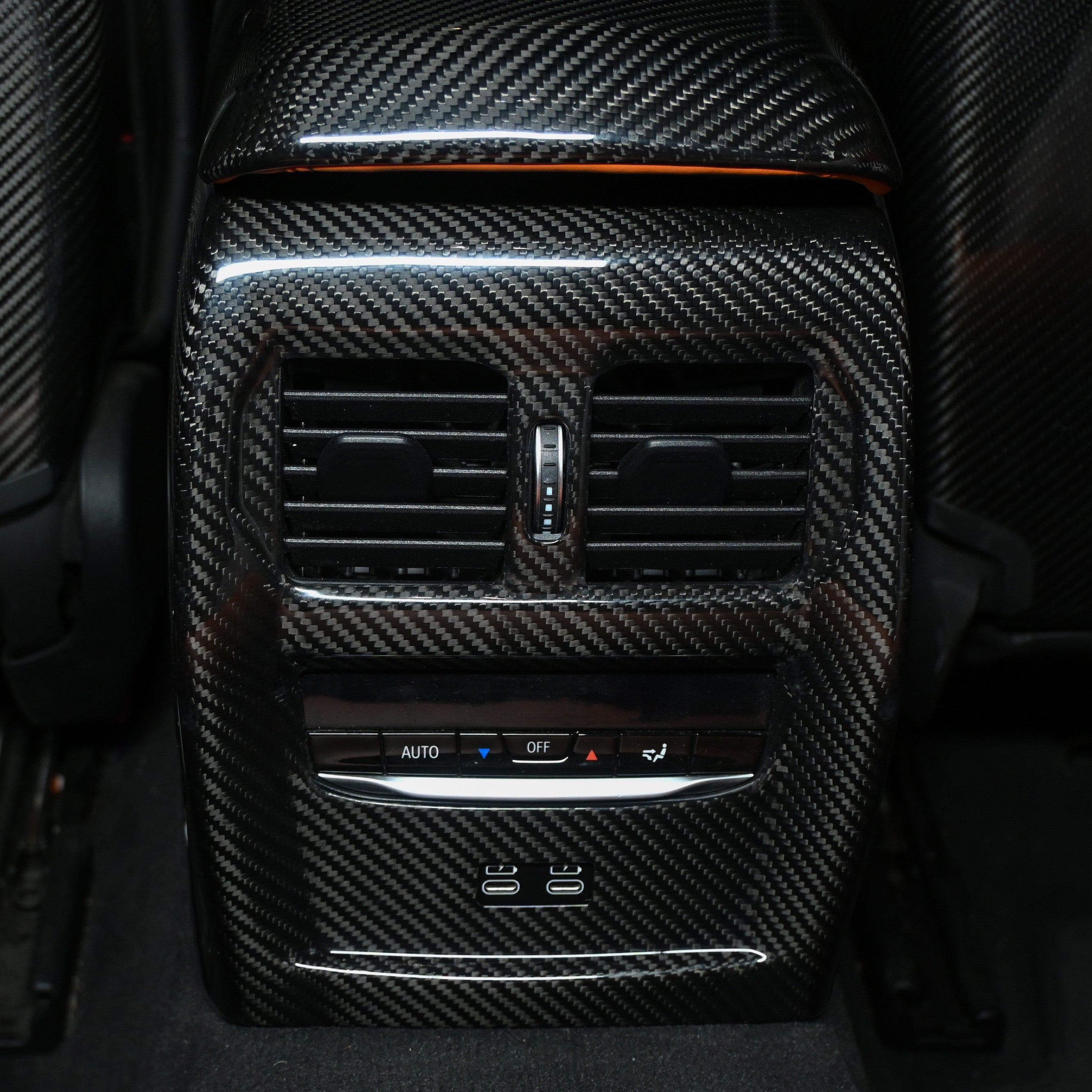 BMW M3 M4 carbon fiber rear vent trim installed on the center console rear with air vents