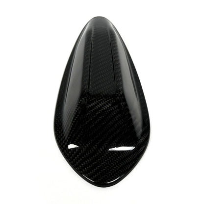 Top down view of the BMW G8X carbon fiber roof antenna cover, weave running the length of the fin