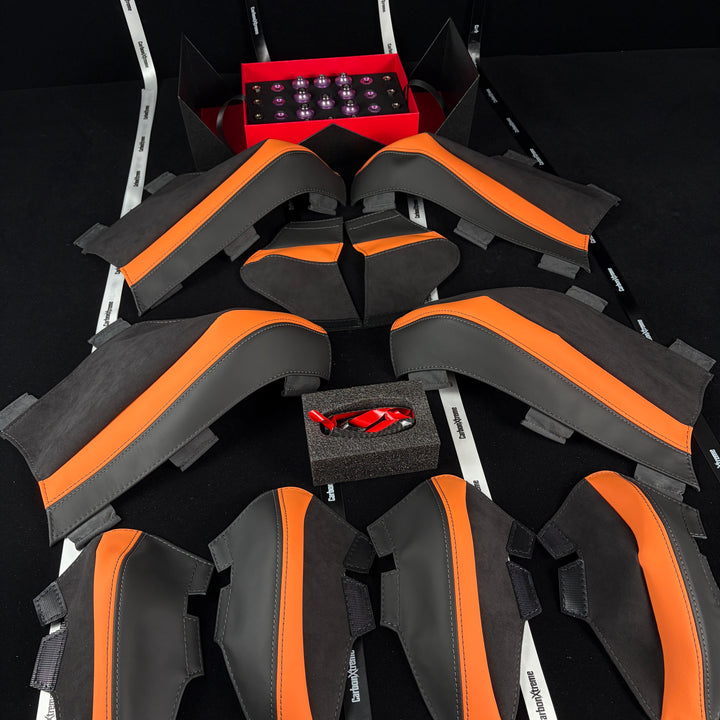 BMW G80 M3 S58 titanium engine bay dress-up bolt kit in Purple, carbon fiber gear selector cover, and Kyalami Orange seat protector set packed and shipped to CT, United States