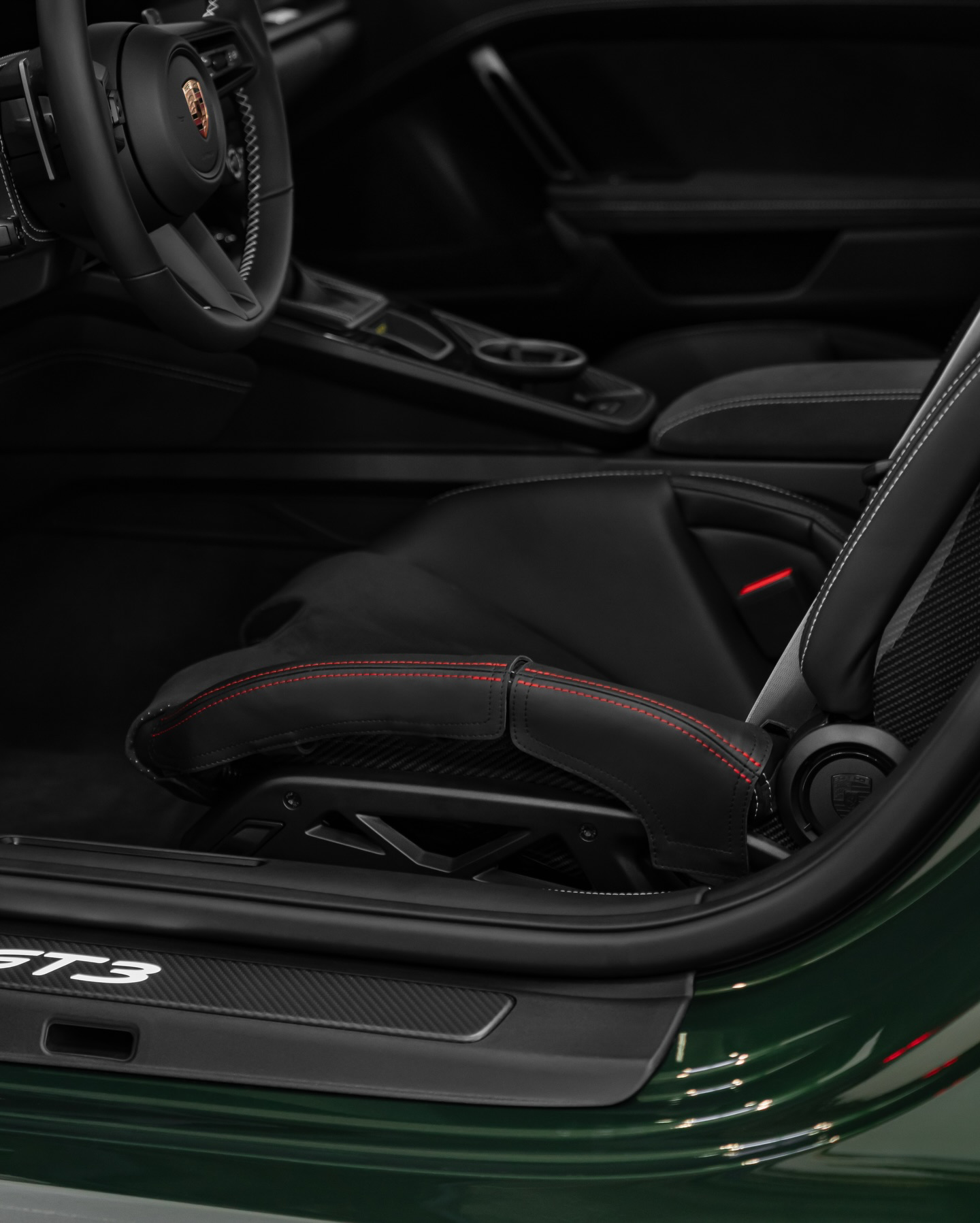 Porsche 911 GT3 992.2 bucket seat bolster protector, black leather red stitching, in car view