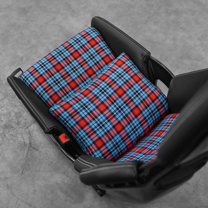 Two blue and red tartan space increase pillows stacked in a Porsche 918 style carbon bucket seat