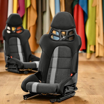 Porsche 918 style carbon fiber bucket seat with embossed crest headrest and carbon fiber headrest yoke, three-quarter view