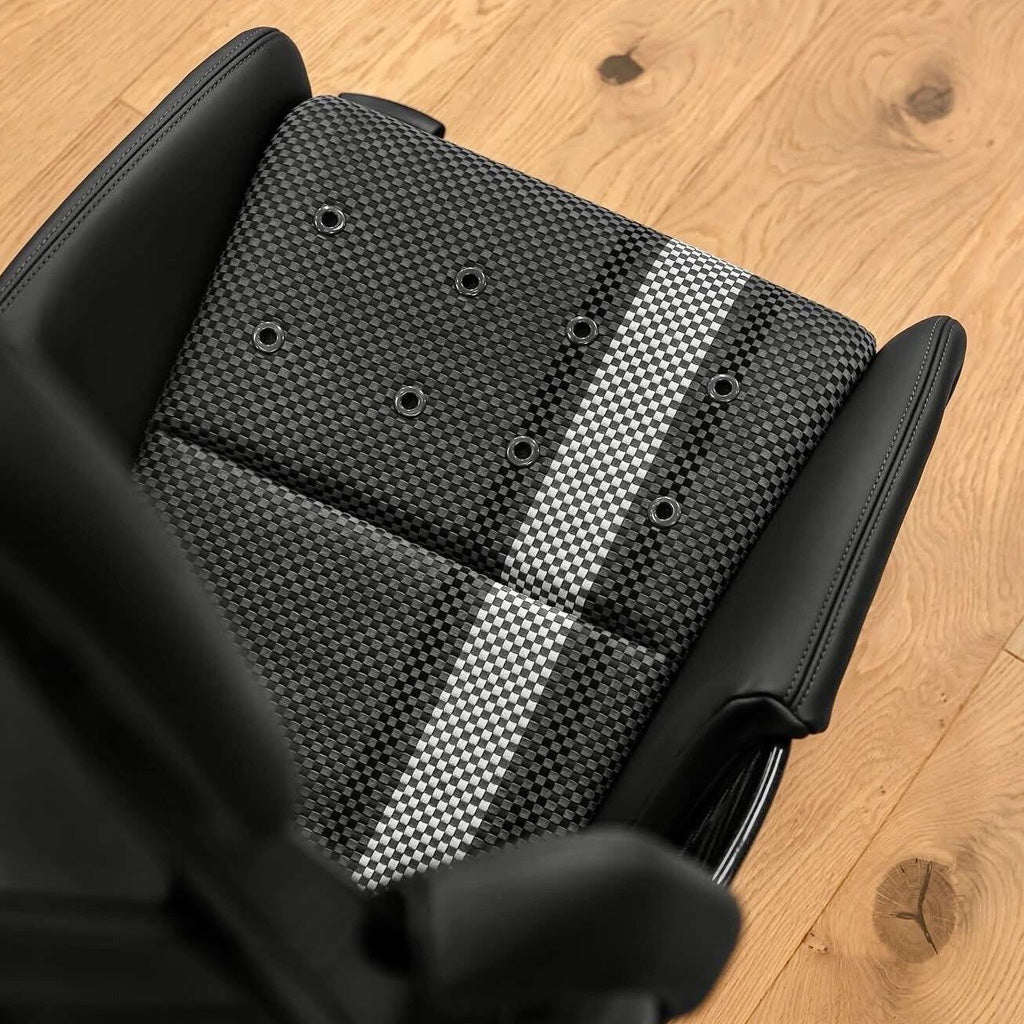 Porsche 918 style carbon fiber bucket seat cushion, carbon-weave center panel with white stripe and perforation, top view