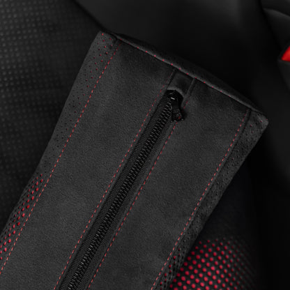 Close up detail of the zipper and red contrast stitching on a black Alcantara Porsche lumbar support pillow