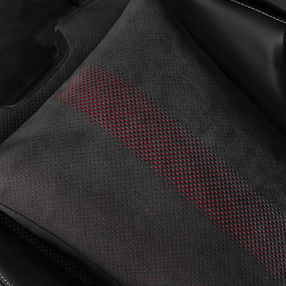 Close up of the black Alcantara fabric with red perforated dot pattern on a Porsche 992.2 space increase pillow