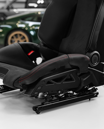 Porsche 992.2 GT3 carbon folding bucket seat with bolster protector, side view showing folding base