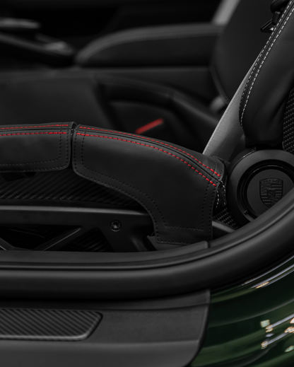 Porsche 992.2 GT3 bucket seat outer bolster protector, black leather and red stitching detail