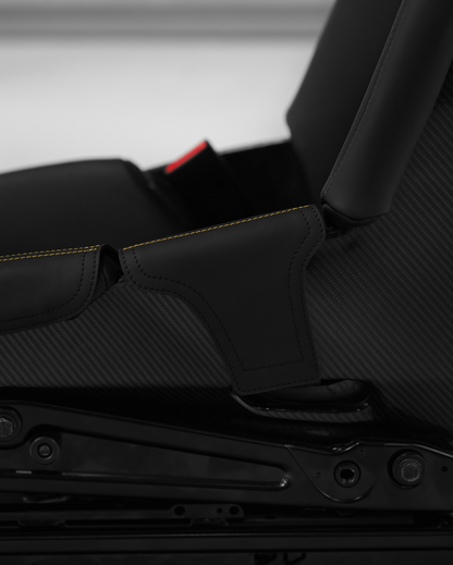 Porsche carbon bucket seat with black leather bolster protector, side view, made to order in Germany