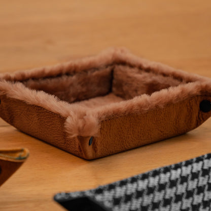 Small brown leather valet tray lined with soft shearling, snap corner construction